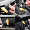 Car cleaning brush being used on various car interior parts.
